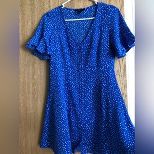 Blue dress with white polka dots.
